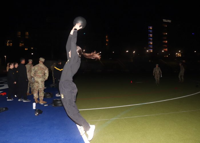 Cadet performing the standing power throw during the ACFT